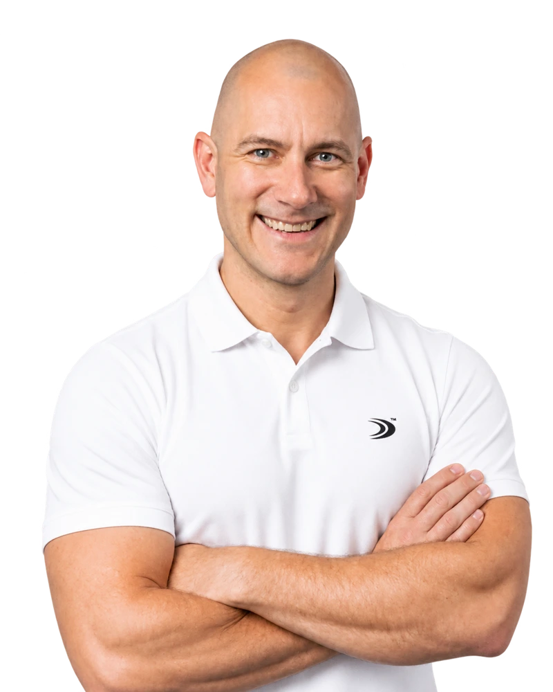 Matthew Carney smiling in a white polo shirt